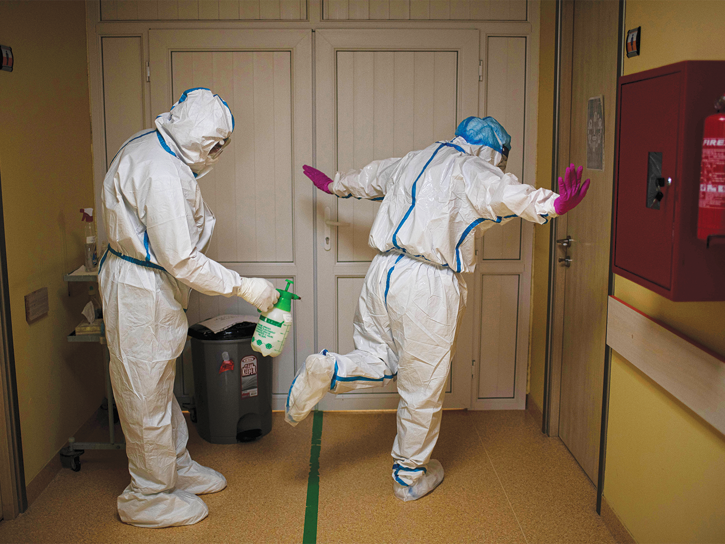 Medical staff routinely disinfect each other.