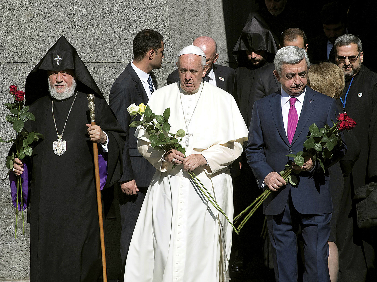 Pope Francis, Catholicos of All Armenians Karekin II and President Serzh Sargsyan arrive for a ceremony at the Tzitzernakaberd Genocide Memorial.