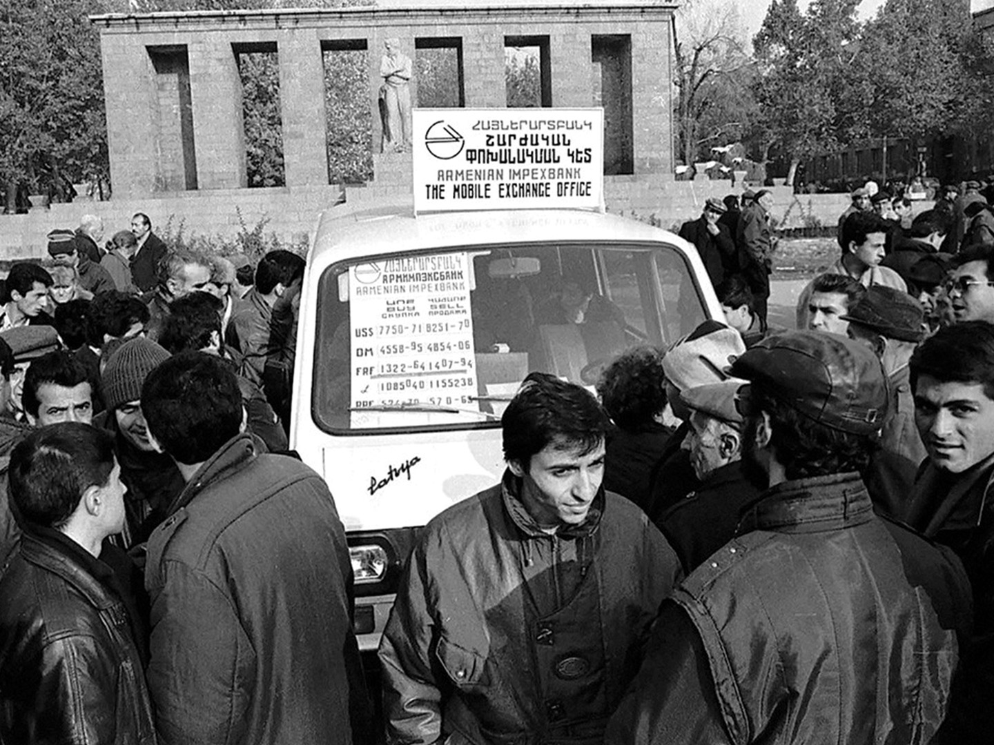 Masses in Yerevan besiege a mobile exchange office across the recently-established Central Bank of Armenia in 1993 to trade their rubles for the country’s new national currency— the dram.