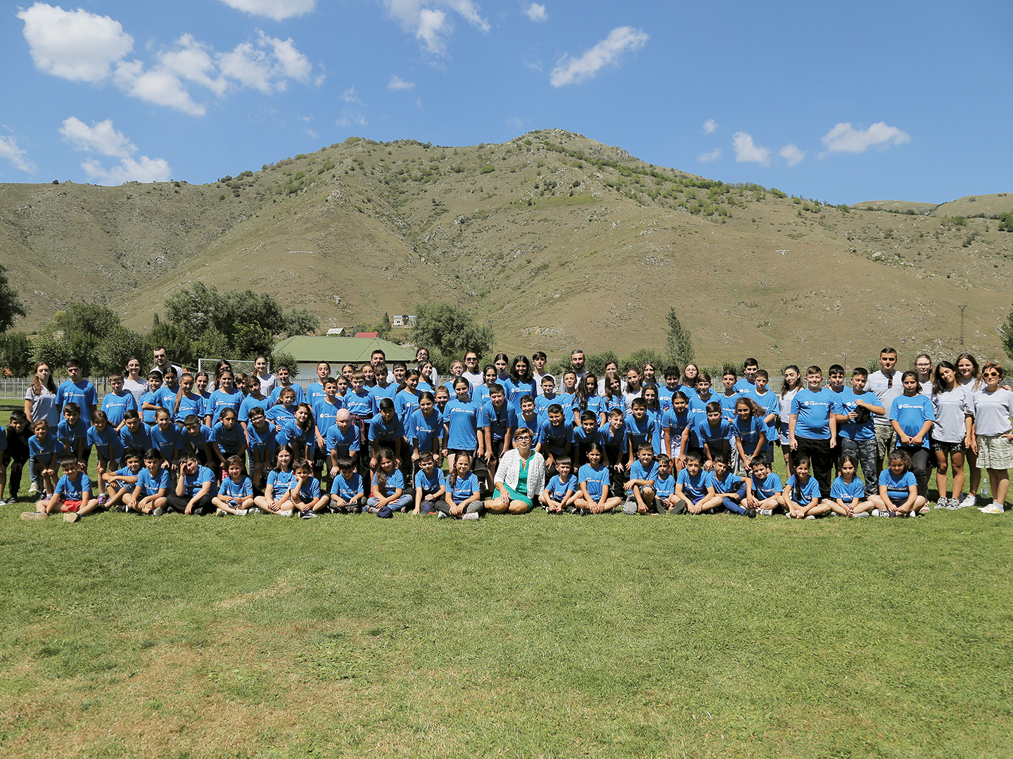 The first cohort of Camp Nairi poses for a group photo with camp director Hermin  Duzian (center) and camp leaders.