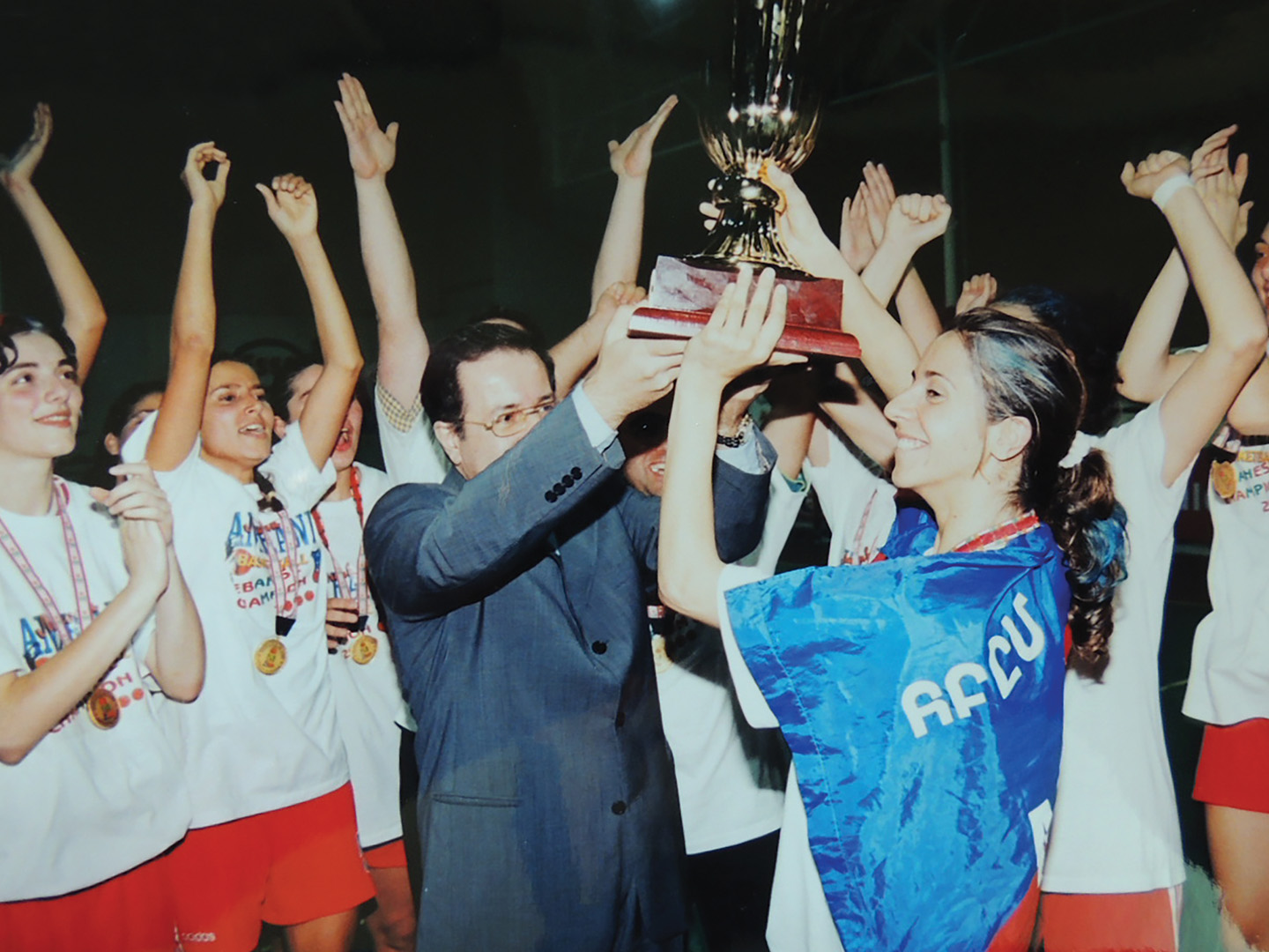 In 2000, jubilant AGBU-AYA champions of the Lebanese National Basketball League are presented with the coveted Cup by the Lebanese Basketball Federation’s president. 