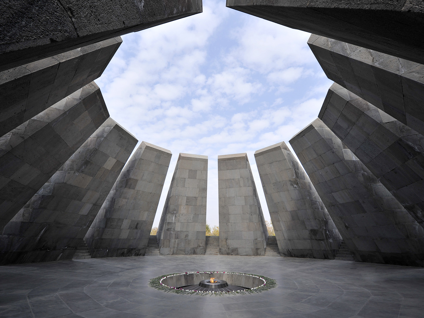 Flowers adorn the flame at the Armenian Genocide memorial, on the hill of Dzidzernagapert in Yerevan.