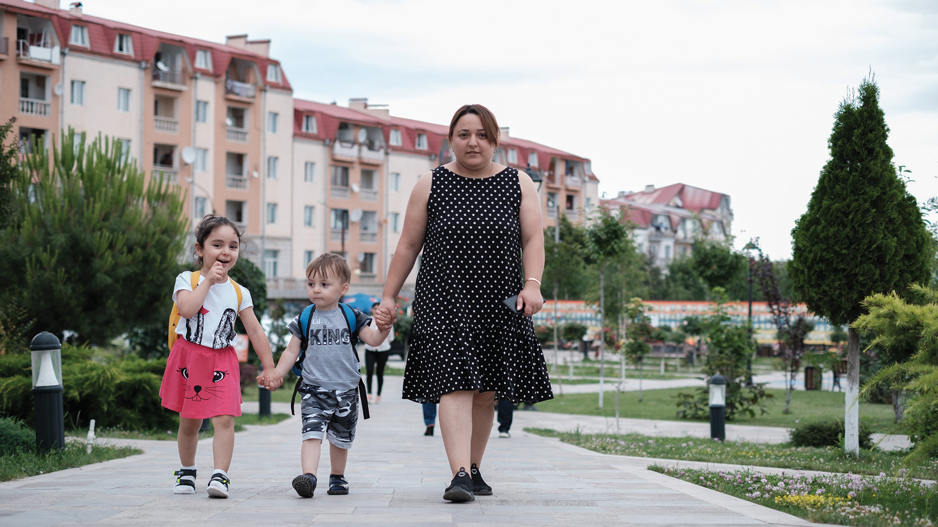 Elina Hurumyan walks her two children Anush and Armen to kindergarten