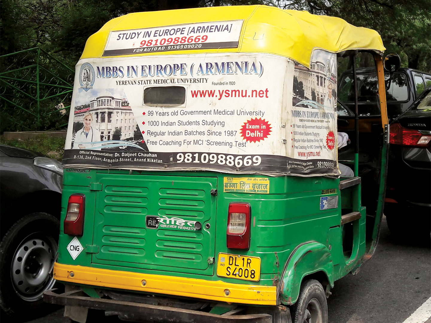 An auto-rickshaw in New Delhi advertises Yerevan State Medical University.