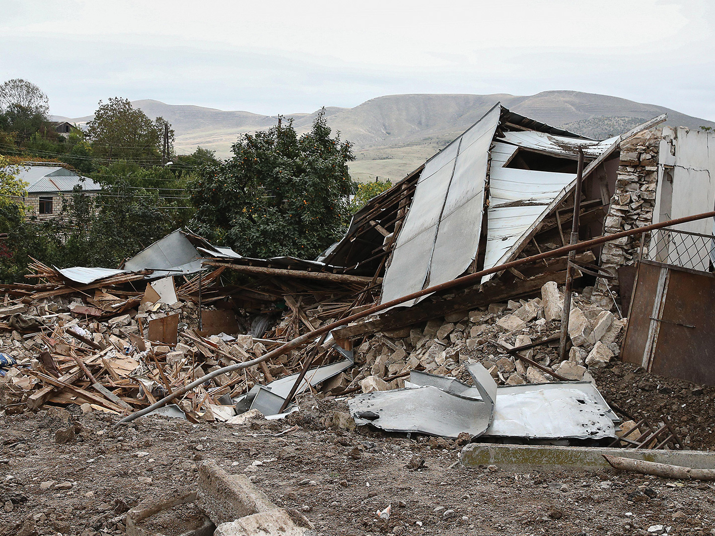 MARTUNI, NAGORNO-KARABAKH - OCTOBER 21, 2020: A house damaged by a military strike in the town of Martuni. The fighting between Armenia and Azerbaijan over the disputed Caucasus Mountains territory of Nagorno-Karabakh resumed in late September. 