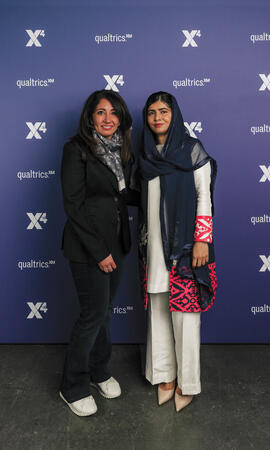 Kazanjian poses with Nobel Peace Prize winner Malala Yousafzai at the Qualtrics X4 Summit.