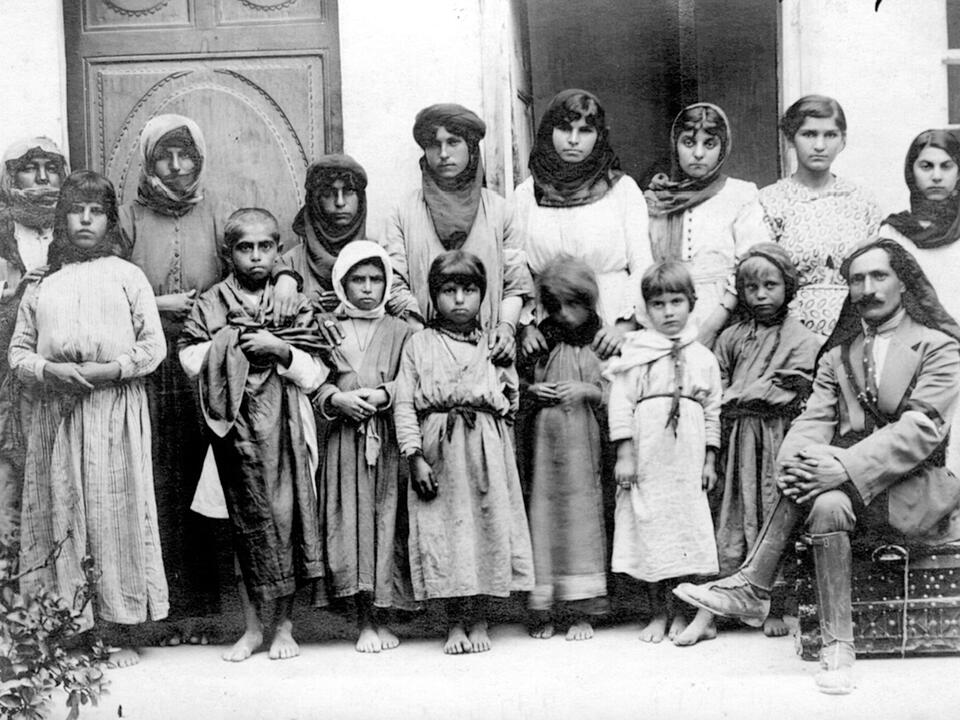 Recovered Armenian women and children with Levon Yotneghperian (right) in 1919 at the AGBU Home for Refugees in Damascus