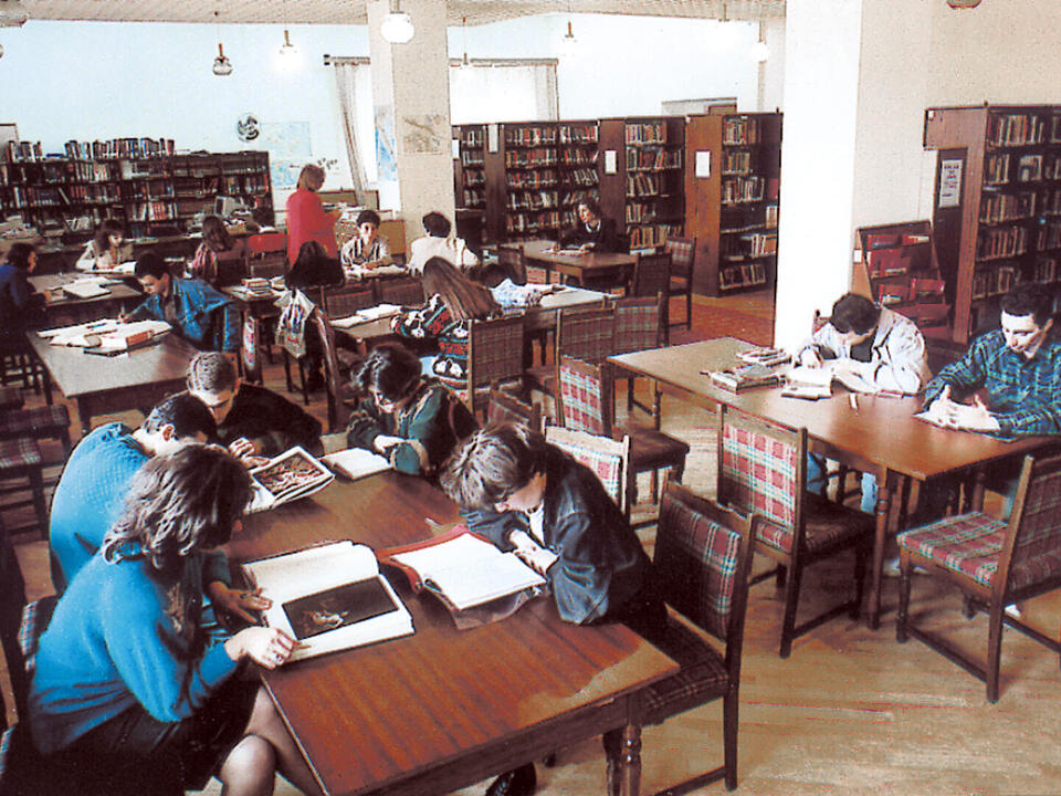 AUA students sitting together and studying in the library