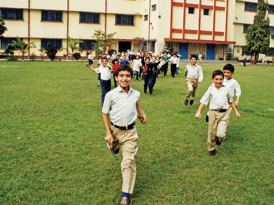 Kids running in a school yard