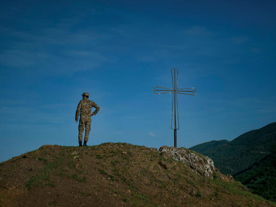 A soldier watches from a vantage point in the village of Taghaser in the Hadrut province of Karabakh