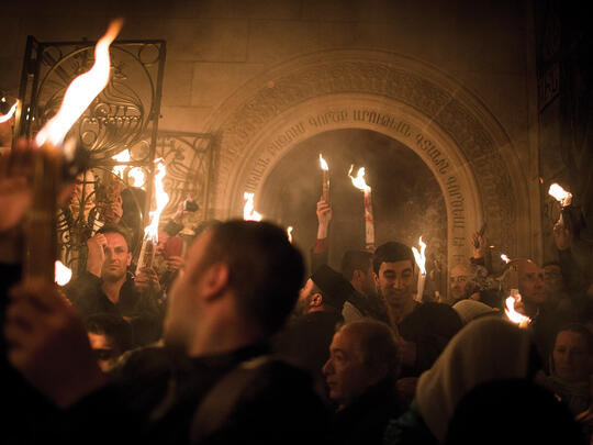 Armenian Orthodox Christian worshippers take part in the Holy Fire ceremony at the Church of the Holy Sepulchre.