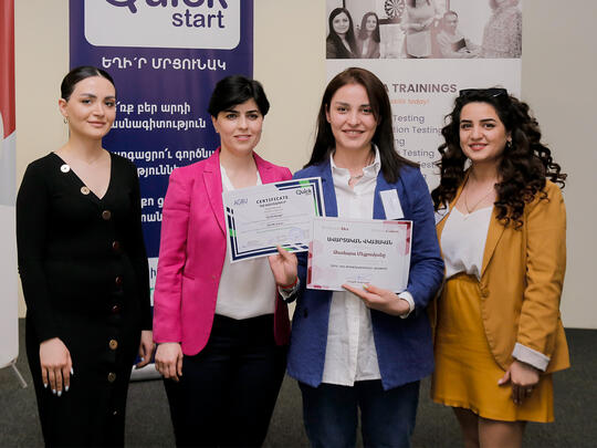 A participant from Women Coders receiving Her graduation certificate