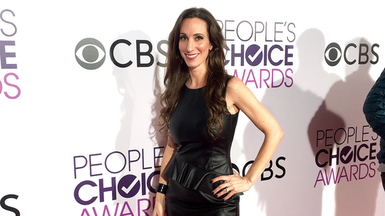 Long haired lady in a black dress at Peoples Choce Awards