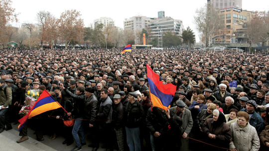 Thousands of Armenian citizens in Freedom Square in Yerevan during a rally in support of democratic reforms on February 22, 2013.