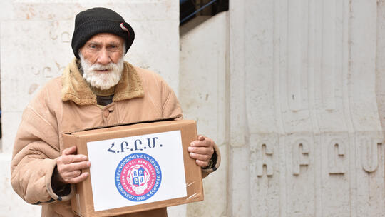 A Syrian Armenian senior received a food box contributed by AGBU Syria relief