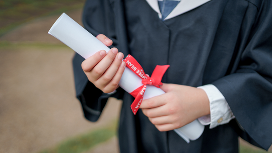 Graduation Holding Diploma